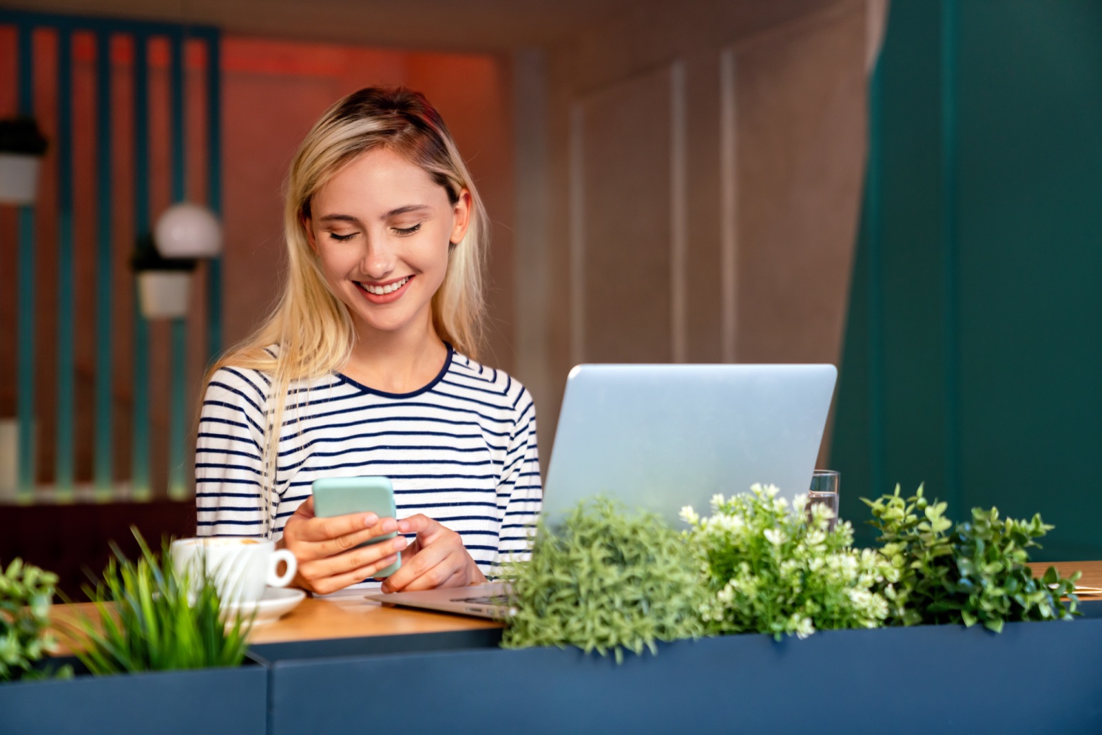 User smiling while following matched betting steps on a phone